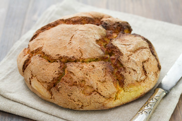 corn bread on napkin with knife
