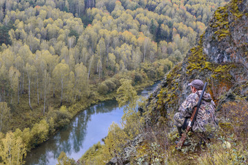 A hunter with a gun