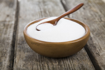 Sugar in a wooden bowl