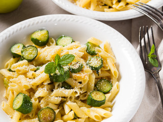 Pennette pasta with zucchini, mint leaves and parmesan