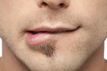 male biting his lips
