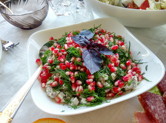 Healthy salad with pomegranate seeds