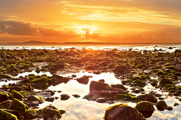 orange reflections at rocky beal beach