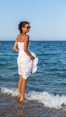 Woman relaxing at the seaside.