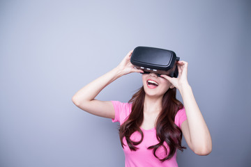 Happy woman watching virtual reality