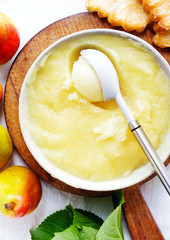 Organic homemade pear sorbet frozen in a deep plate and ripe pea