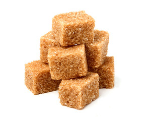 Brown cane sugar cubes isolated.