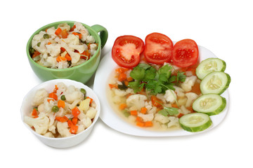 Porcelain plate with vegetable soup on white background