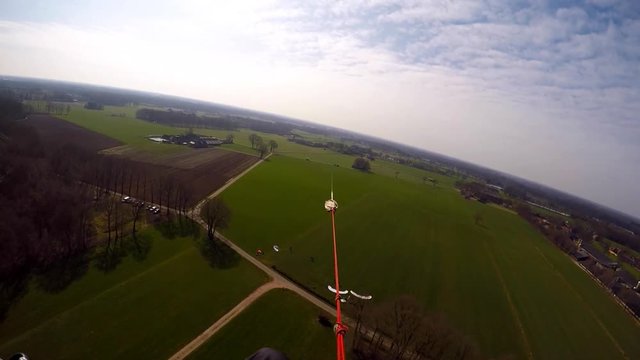 A para glider is being pulled-up by a winch cable