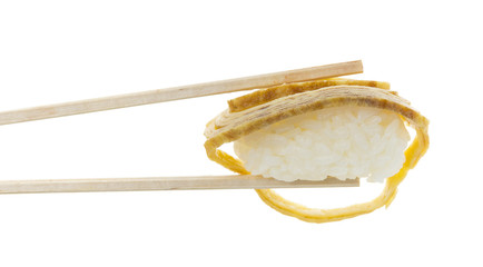 Sushi nigiri in copsticks isolated on white background