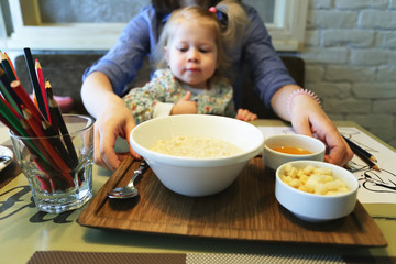 Little girl ready to eat her healthy breakfast, selective focus