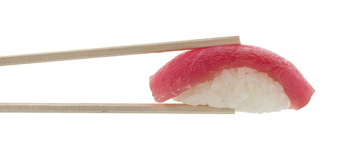 Sushi nigiri in copsticks isolated on white background