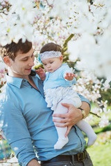 Happy father with his cute daughter