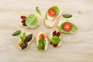 Sandwiches with mascarpone, dried tomatoes, basil