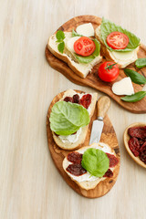 Sandwiches with mascarpone, dried tomatoes, basil