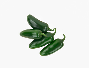 Four Green Spicy Jalapeno Peppers Stacked and Isolated on White.