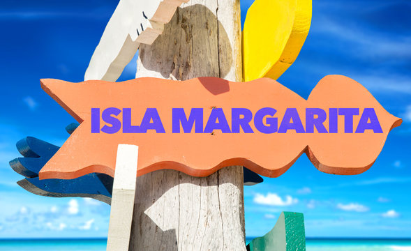 Isla Margarita signpost with beach background
