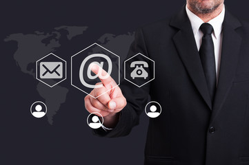 Business man pressing contact us using email digital button