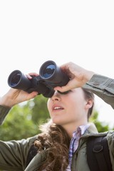 Obraz premium Woman using binoculars