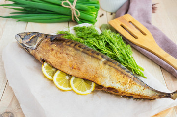 Baked sea fish ( mackerel) on wooden background. 