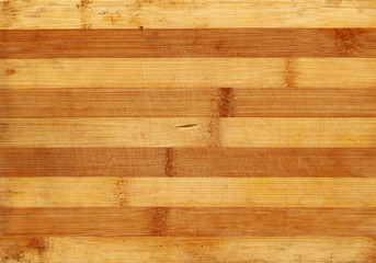 Bamboo wood scratched board realistic photo texture. Warm striped background for your design.