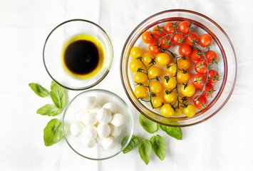 ingredients on white. Cherry tomatoes: red and yellow. little mo