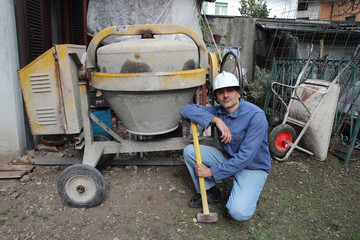 construction worker with cement mixer