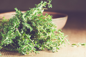 fresh thyme on the wooden table