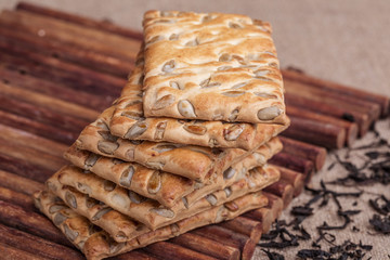 crackers with sunflower seeds and dried tea leaves