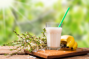 Fresh milk, banana drink on wooden table, assorted protein cocktail with fresh fruits.