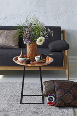 coffee table and sofa with modern brick wall decoration