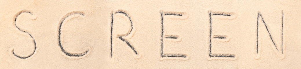 Screen lettering drawn on sand
