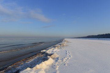 Winter shoreline of baltic sea with snow and ice