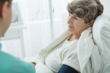 Sad old woman at hospital