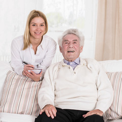 Female caregiver and senior man