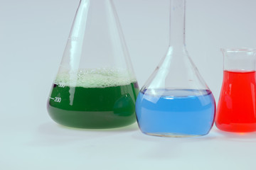 Glass laboratory apparatus with green and blue water