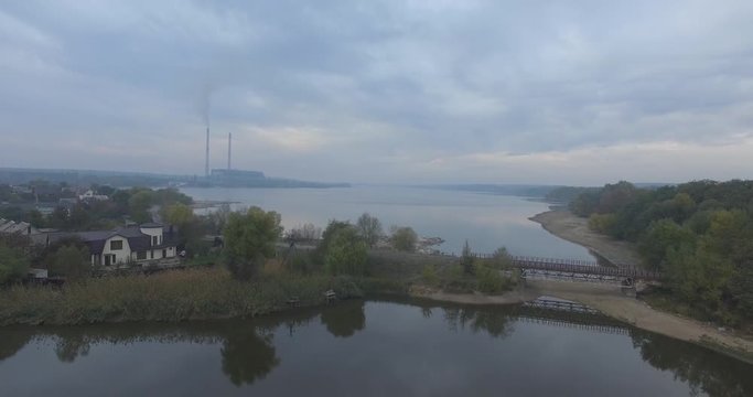 4k Aerial shot of the heating plants over the river