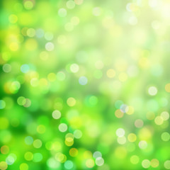 soft bokeh background in shades of green, white and yellow
