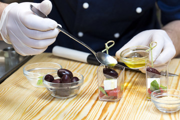 cook prepares canapes in the kitchen at the restaurant