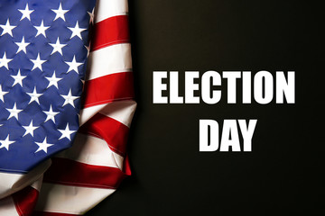 Fototapeta na wymiar Text Election Day and USA National Flag on black background