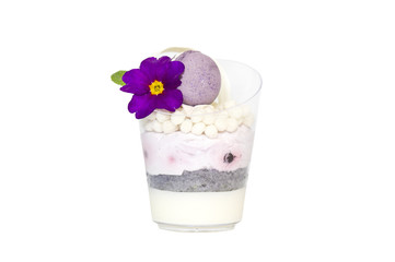 mini canapes in plastic cups decorated with edible flowers