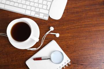 Office table with supplies and gadgets, top view