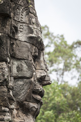 Fototapeta na wymiar Serenity stone carved face in Bayon temple, Angkor Thom, Cambodia