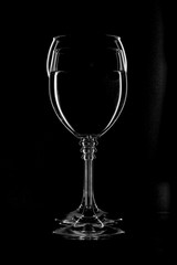 Silouette of two wine glasses on black background