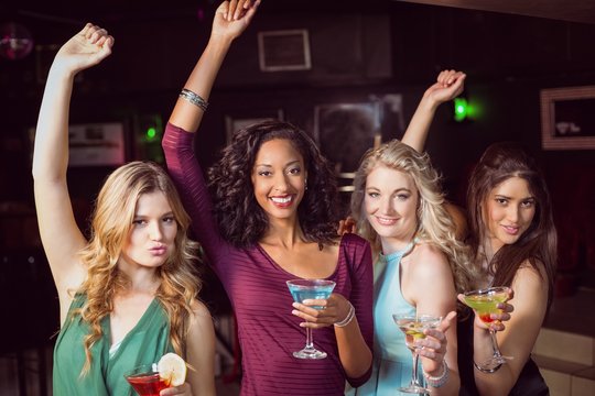 Portrait of friends having a drink in a bar 