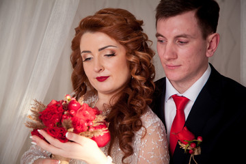 bride and groom in a white decoration