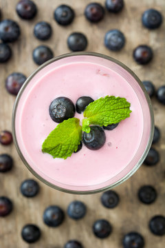 Fresh blueberry smoothie on rustic wood
