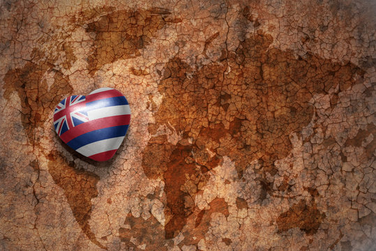 heart with hawaii state flag  on a vintage world map crack paper background