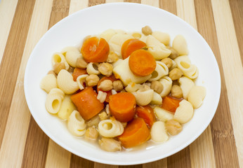 Vegetable soup with pasta, carrots and chickpeas