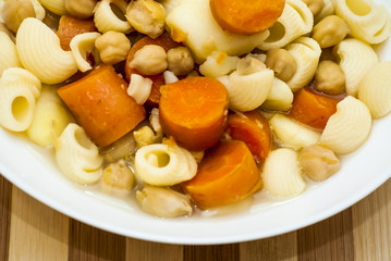 Vegetable soup with pasta, carrots and chickpeas